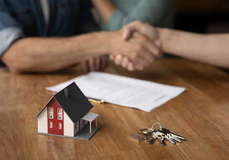 shaking hands over completed real estate transaction