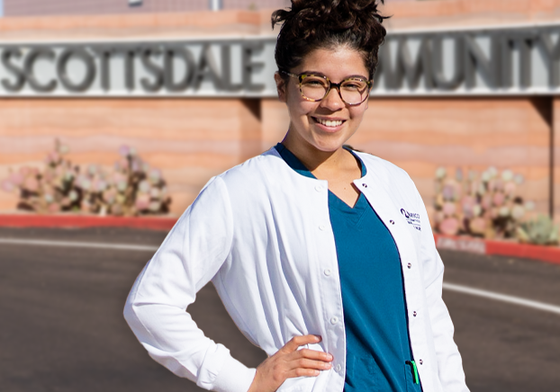 nursing student at entrance to Scottsdale Community College