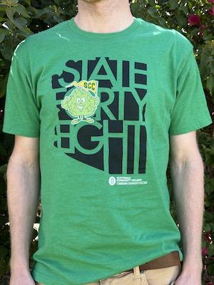 person wearing a green State Forty Eight t-shirt with the Artie logo and SCC logo