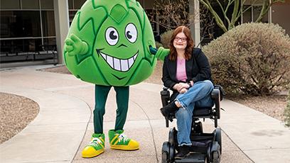 Artie the Artichoke Mascot with a student in a wheelchair