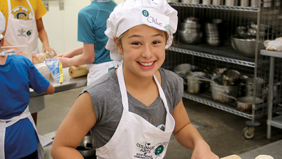 A photo of kids learning about cooking at SCC's culinary program.