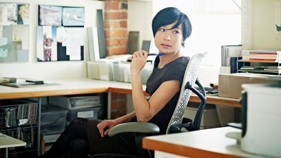designer at desk with laptop