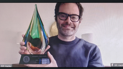 Bill Hader holding outstanding alumni award