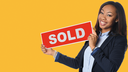 Realtor holding SOLD sign