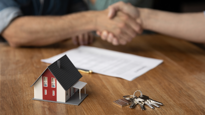 shaking hands over completed real estate transaction