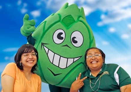two students with Artie the Artichoke mascot