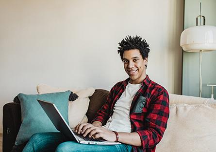 student with laptop learning from home