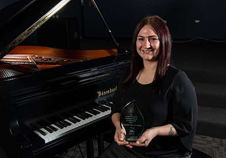 Lauren Nicole Berry seated at piano