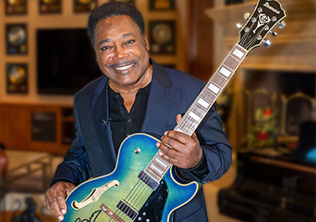 George Benson with autographed guitar