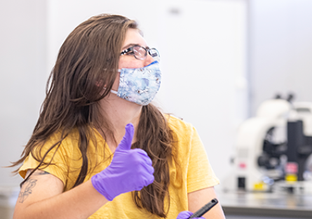 student wearing mask in a lab