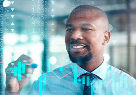 business person writing on a transparent glass board