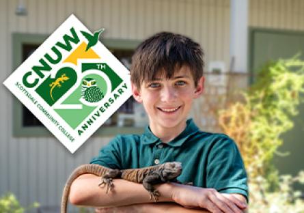 adolescent holding reptile with CNUW 25th Anniversary logo in background