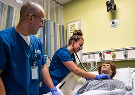 nursing students administering to patient