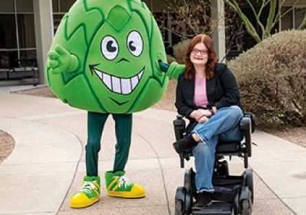 Artie the Artichoke Mascot with a student in a wheelchair