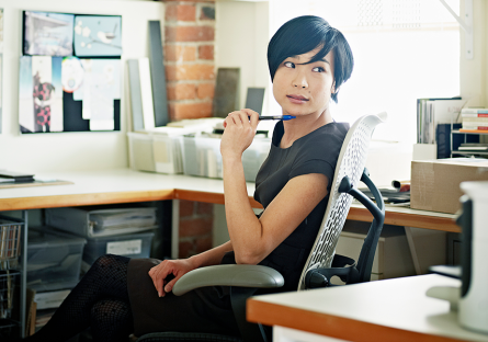 designer at desk with laptop