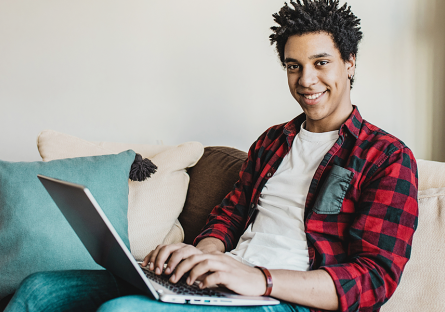 student with laptop learning from home