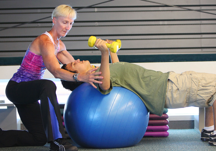 personal trainer with student