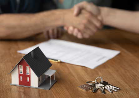 shaking hands over completed real estate transaction