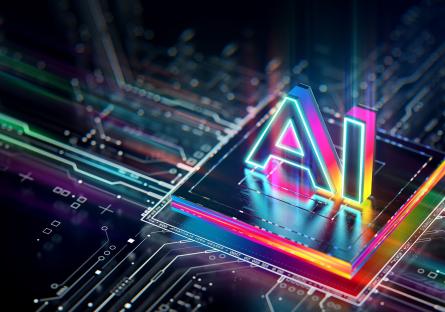 The words "AI" in a colorful text above a CPU