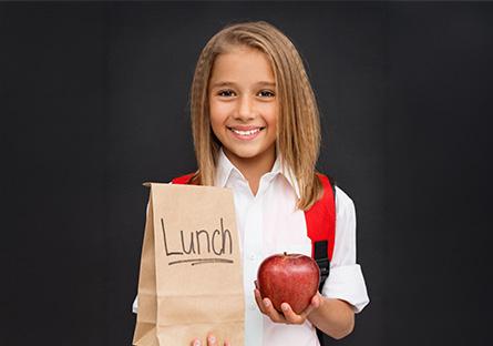 child holding apple