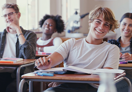 happy high school students in the classroom