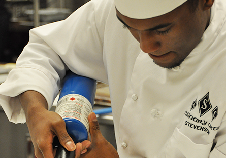 scc culinary art student in kitchen