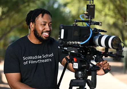student wearing a Scottsdale School of Film+Theatre t-shirt