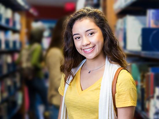 student in library