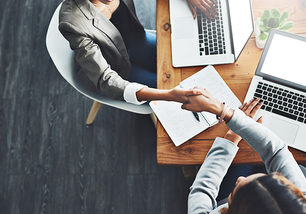 shaking hands over a business deal