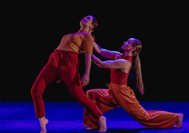 two dancers performing on stage