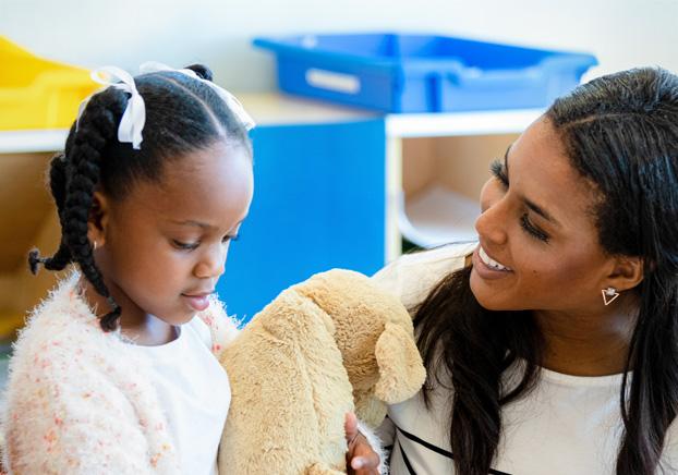 teacher working with young student