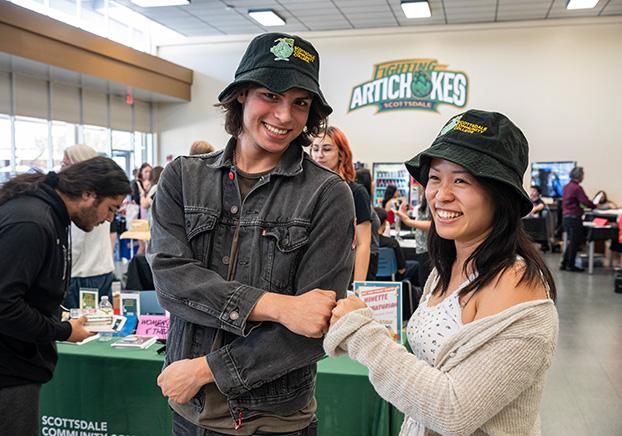 two students at an event in the cafeteria