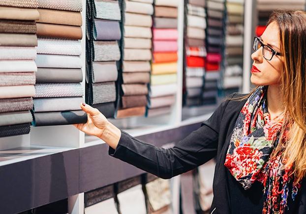 interior design student examining fabric samples