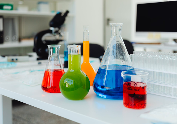 colorful laboratory flasks on a table