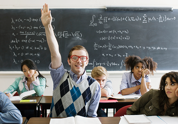 student eagerly raising hand in classroom