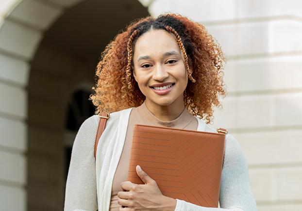 Student holding binder
