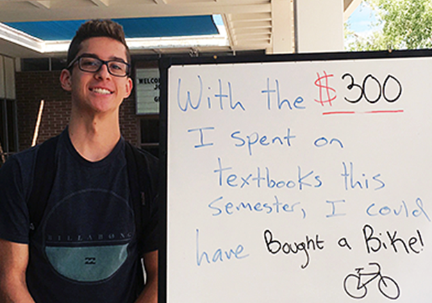 student by board stating $300 spent on books