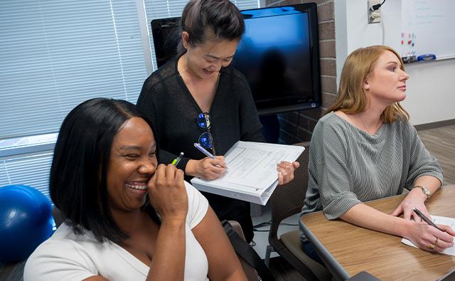 Three STEP students laughing